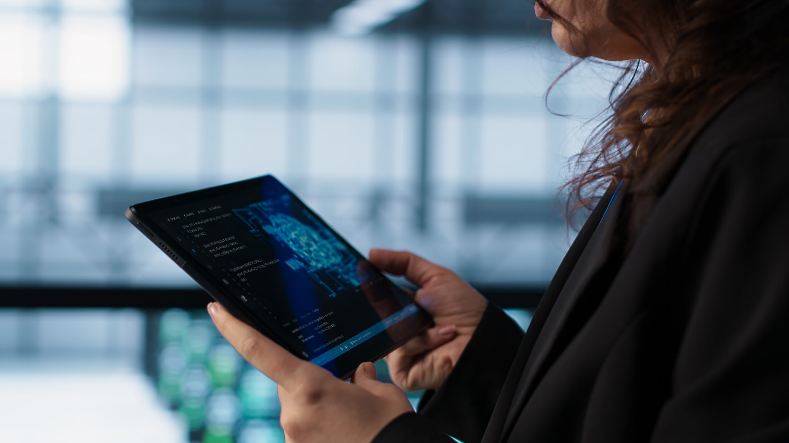 Engineer in data center with tablet integrating AI driven automation tools